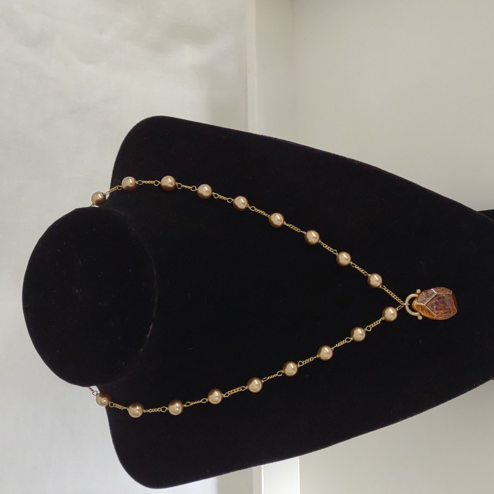 Gold toned Monet necklace with iridescent gold pearls and amber pendant